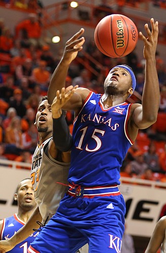 Kansas forward Carlton Bragg Jr. (15) fights for a rebound with Oklahoma State guard Leyton Hammonds (23) during the second half, Tuesday, Jan. 19, 2016 at Gallagher-Iba Arena in Stillwater, Okla.