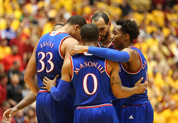 The Kansas players huddle together to try to rally from behind during the second half, Monday, Jan. 25, 2016 at Hilton Coliseum in Ames, Iowa.