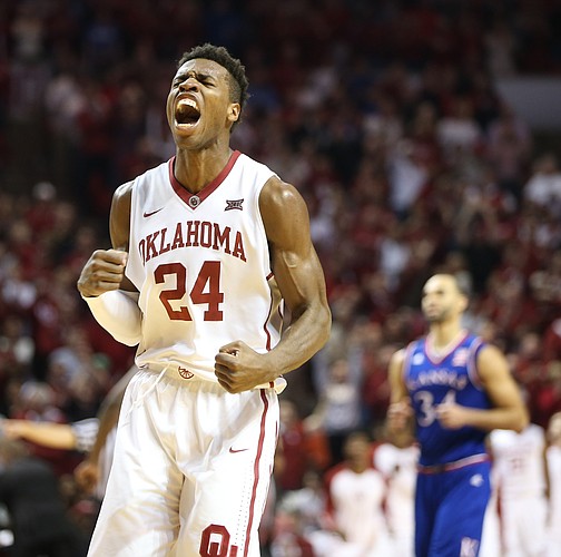 Oklahoma guard Buddy Hield (24) roars after hitting a three against the Jayhawks during the second half, Saturday, Feb. 13, 2016 at Lloyd Noble Center in Norman, Okla.