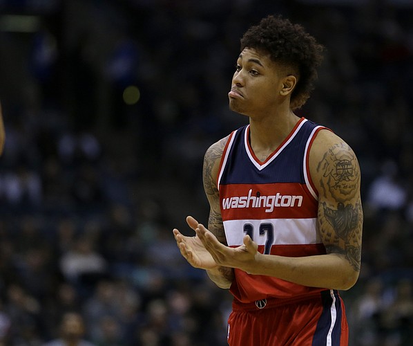 Washington Wizards' Kelly Oubre Jr. reacts during the second half of an NBA basketball game against the Milwaukee Bucks Thursday, Feb. 11, 2016, in Milwaukee. The Bucks won 99-92. (AP Photo/Aaron Gash)