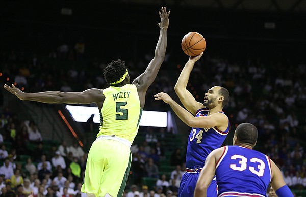 Baylor forward Johnathan Motley (5) extends to defend against a shot from Kansas forward Perry Ellis (34) during the first half, Tuesday, Feb. 23, 2016 at Ferrell Center in Waco, Texas.