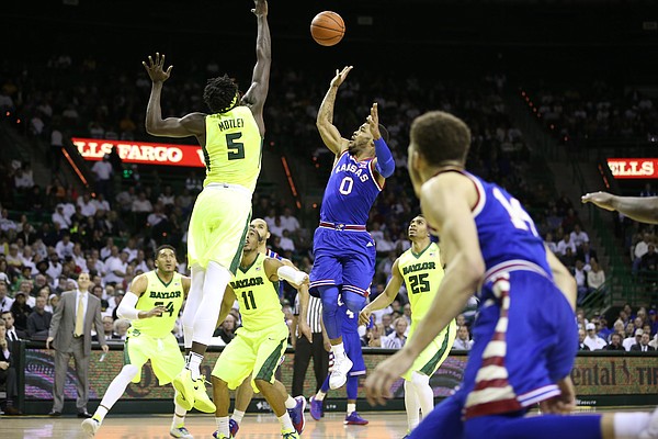 Kansas guard Frank Mason III (0) puts a floater over Baylor forward Johnathan Motley (5) during the first half, Tuesday, Feb. 23, 2016 at Ferrell Center in Waco, Texas.
