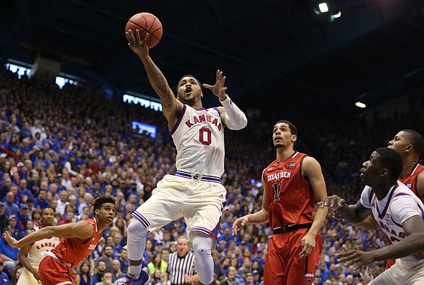 Kansas guard Frank Mason III (0) floats in for a bucket past Texas Tech forward Zach Smith (11) during the second half, Saturday, Feb. 27, 2016 at Allen Fieldhouse.