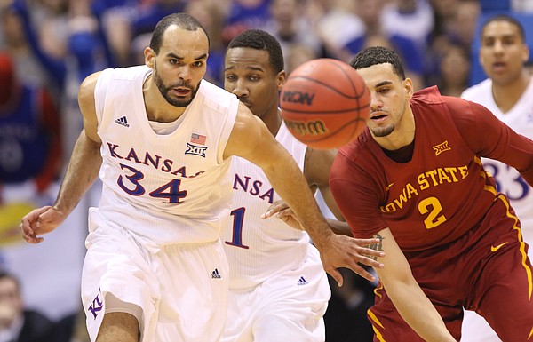 Kansas forward Perry Ellis (34) chases down a loose ball with Iowa State forward Abdel Nader (2) and teammate Wayne Selden Jr. during the first half on Saturday, March 5, 2016 at Allen Fieldhouse.