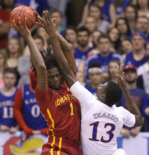 Kansas forward Cheick Diallo (13) fights for a rebound with Iowa State forward Jameel McKay (1) during the first half on Saturday, March 5, 2016 at Allen Fieldhouse.