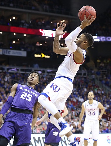 Kansas guard Frank Mason III (0) pulls up for a shot against Kansas State forward Wesley Iwundu (25) during the first half, Thursday, March 10, 2016 at Sprint Center in Kansas City, Mo.