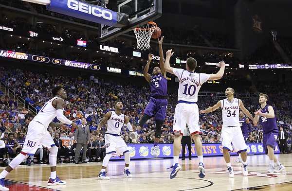 Kansas State guard Barry Brown (5) gets to the bucket against the Jayhawks during the second half, Thursday, March 10, 2016 at Sprint Center in Kansas City, Mo.
