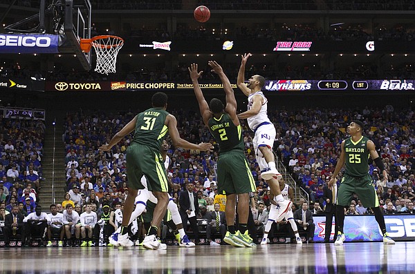 Kansas forward Perry Ellis (34) puts up a floater over Baylor forward Rico Gathers (2) during the first half, Friday, March 11, 2016 at Sprint Center in Kansas City, Mo.