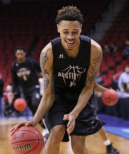 Austin Peay guard Khalil Davis (11) smiles as he and hist teammates get warmed up on Wednesday, March 16, 2016 at Wells Fargo Arena in Des Moines, Iowa. The Jayhawks will take on the Governors Thursday.