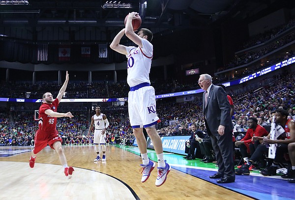 Kansas guard Sviatoslav Mykhailiuk (10)	shoots in a 3-point basket in a first-round NCAA tournament game against the Austin Peay Governors Thursday, March 17, 2016 at Wells Fargo Arena in Des Moines, IA. 