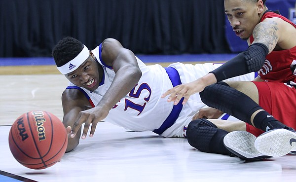 Kansas forward Carlton Bragg Jr. (15) dives for a loose ball in the Jayhawks win against the Austin Peay Governors Thursday, March 17, 2016 at Wells Fargo Arena in Des Moines, IA. 