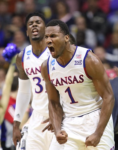 Kansas guard Wayne Selden Jr. (1) and Jamari Traylor celebrate a three from teammate Perry Ellis during the first half against UConn during the first half on Saturday, March 19, 2016 at Wells Fargo Arena in Des Moines.