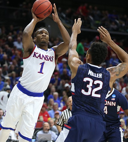 Kansas guard Wayne Selden Jr. (1) leans in for a shot over Connecticut forward Shonn Miller (32) during the first half on Saturday, March 19, 2016 at Wells Fargo Arena in Des Moines.