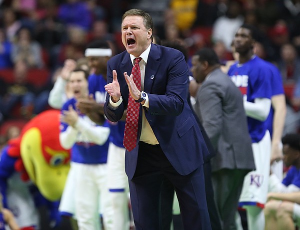 Kansas head coach Bill Self applauds the Jayhawks as they widen their lead during the second half on Saturday, March 19, 2016 at Wells Fargo Arena in Des Moines.