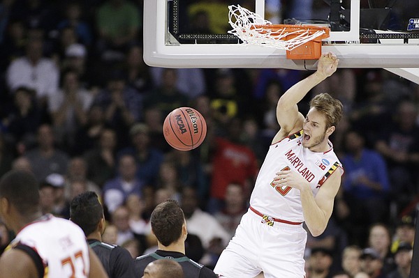Maryland forward Jake Layman (10) dunks during the second half of a second-round men's college basketball game against Hawaii in the NCAA Tournament in Spokane, Wash., Sunday, March 20, 2016. (AP Photo/Young Kwak)
