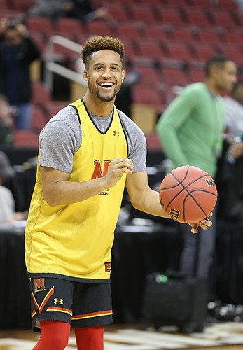 Maryland guard Melo Trimble (2) laughs as he pulls up for a three during practice on Wednesday, March 23, 2016 at KFC Yum! Center in Louisville, Kentucky.