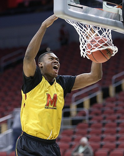 Maryland center Diamond Stone delivers a dunk during practice on Wednesday, March 23, 2016 at KFC Yum! Center in Louisville, Kentucky.