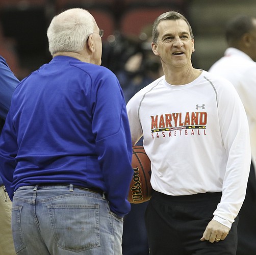 Maryland head coach Mark Turgeon laughs with Kansas radio broadcaster Bob Davis during practice on Wednesday, March 23, 2016 at KFC Yum! Center in Louisville, Kentucky.