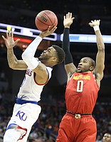 Kansas Jayhawks guard Frank Mason III (0) gets to the bucket past Maryland guard Rasheed Sulaimon (0) during the first half, Thursday, March 24, 2016 at KFC Yum! Center in Louisville, Kentucky.