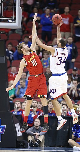 Kansas Jayhawks forward Perry Ellis (34) gets a shot off against Maryland forward Jake Layman (10) during the second half, Thursday, March 24, 2016 at KFC Yum! Center in Louisville, Kentucky.