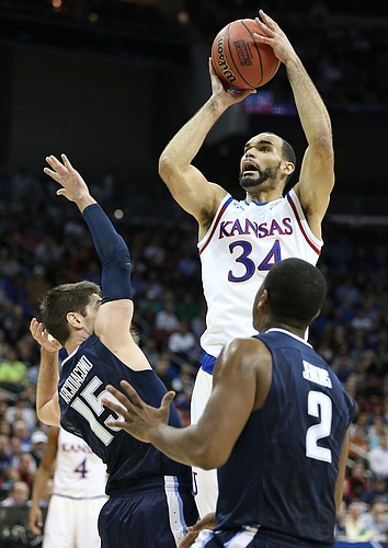 Kansas forward Perry Ellis (34) gets up for a shot over Villanova guard Ryan Arcidiacono (15) during the first half, Saturday, March 26, 2016 at KFC Yum! Center in Louisville, Kentucky.