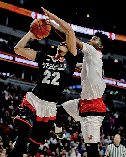 West forward Josh Jackson, right, from Justin-Siena high school/Prolific Prep Academy in Napa, Calif., blocks East forward Jayson Tatum from Chaminade College Preparatory school in St. Louis during the McDonald's All-American boys basketball game, Wednesday, March 30, 2016, in Chicago. (AP Photo/Matt Marton)