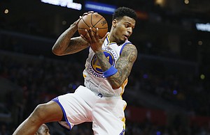 Golden State Warriors' Brandon Rush brings in a rebound against the Los Angeles Clippers during the first half of an NBA basketball game, Saturday, Feb. 20, 2016, in Los Angeles. (AP Photo/Danny Moloshok)