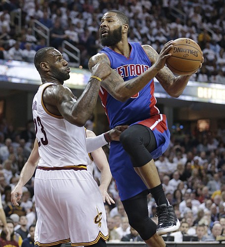 Detroit Pistons' Marcus Morris, right, drives past Cleveland Cavaliers' LeBron James in the second half in Game 2 of a first-round NBA basketball playoff series, Wednesday, April 20, 2016, in Cleveland. The Cavaliers won 107-90. (AP Photo/Tony Dejak)