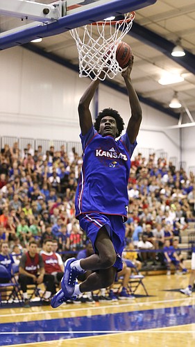 Blue Team guard Josh Jackson soars in for a dunk during the Bill Self basketball camp alumni scrimmage, Wednesday, June 8, 2016 at the Horejsi Athletic Center.