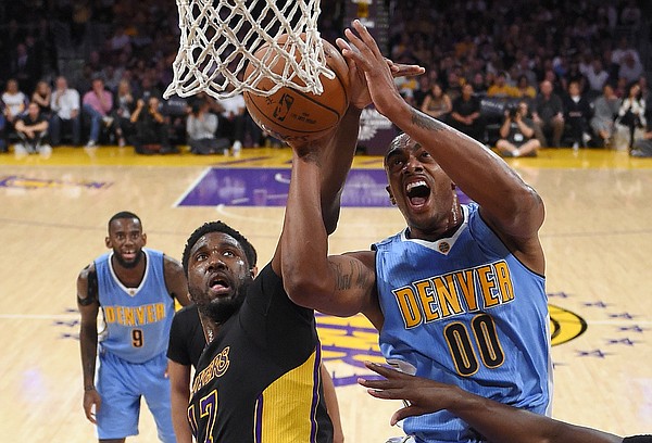 Denver Nuggets forward Darrell Arthur, right, shoots as Los Angeles Lakers center Roy Hibbert defends during the first half of an NBA basketball game Friday, March 25, 2016, in Los Angeles. AP Photo/Mark J. Terrill)