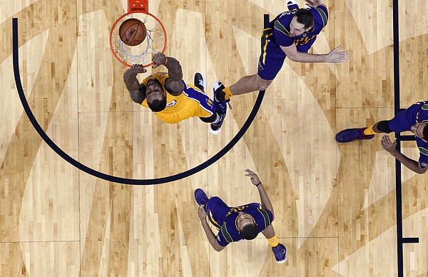 Los Angeles Lakers center Tarik Black (28) slam dunks against New Orleans Pelicans forward Ryan Anderson, top right, in the second half of an NBA basketball game in New Orleans, Thursday, Feb. 4, 2016. The Lakers won 99-96. (AP Photo/Gerald Herbert)