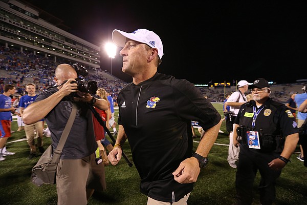 Kansas head coach David Beaty runs off the field with his first win after beating Rhode Island 55-6 on Saturday, Sept. 3, 2016 at Memorial Stadium.