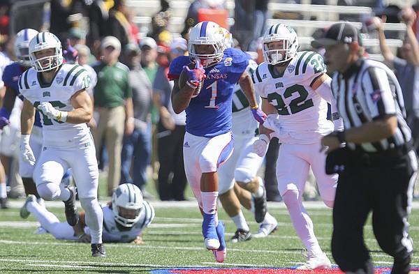 Kansas wide receiver LaQuvionte Gonzalez (1) runs back a kickoff for a touchdown during the second quarter on Saturday, Sept. 10, 2016 at Memorial Stadium.