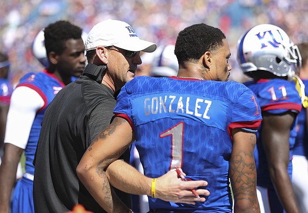 Kansas head coach David Beaty gives a pat on the back to Kansas wide receiver LaQuvionte Gonzalez (1) after Gonzalez fumbled a punt during the second quarter on Saturday, Sept. 10, 2016 at Memorial Stadium.