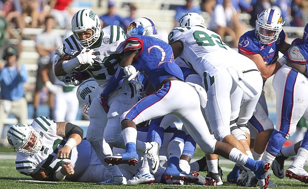 Ohio running back Dorian Brown (28) trudges through the Kansas defense for a first down during the fourth quarter on Saturday, Sept. 10, 2016 at Memorial Stadium.
