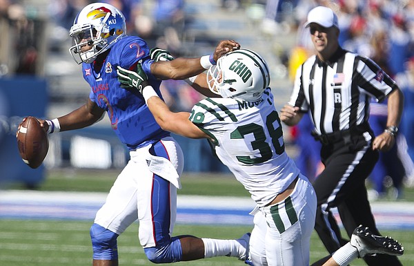 Kansas quarterback Montell Cozart (2) is run out of bounds by Ohio linebacker Chad Moore (38) late in the fourth quarter on Saturday, Sept. 10, 2016 at Memorial Stadium.
