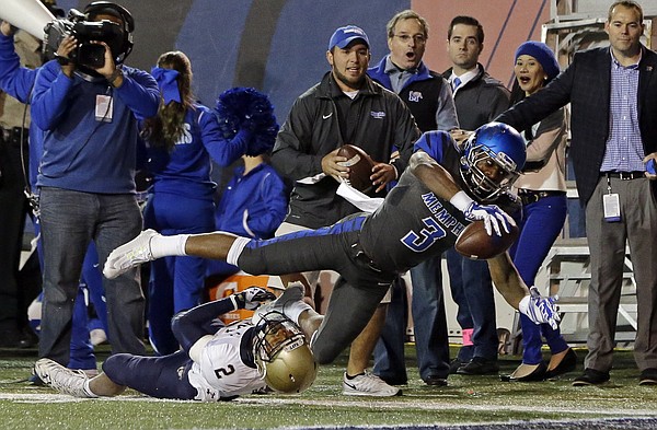 Memphis wide receiver Anthony Miller (3) gets past Navy safety Lorentez Barbour (2) to score a touchdown on an 11-yard pass reception in the first half of an NCAA college football game Saturday, Nov. 7, 2015, in Memphis, Tenn.