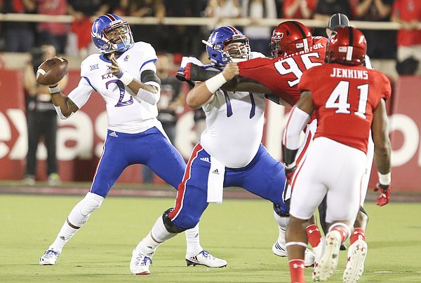 Kansas quarterback Montell Cozart (2) pulls back to throw during the first quarter on Thursday, Sept. 29, 2016 at Jones AT&T Stadium in Lubbock, Texas.