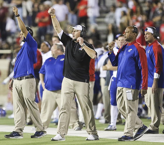 Kansas head coach David Beaty signals a play during the fourth quarter on Thursday, Sept. 29, 2016 at Jones AT&T Stadium in Lubbock, Texas.