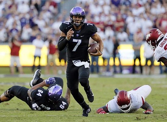 In this Sept. 10, 2016, file photo, TCU quarterback Kenny Hill (7) scrambles out of the pocket to run the ball against Arkansas during an NCAA college football game in Fort Worth, Texas. TCU faces Oklahoma this week in a Big 12 game. (AP Photo/Tony Gutierrez, File)