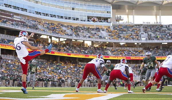 Kansas' Cole Moos (36) punts from the Jayhawks' end zone late in the fourth quarter on Saturday, Oct. 15, 2016 at McLane Stadium in Waco, Texas.