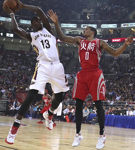 Cheick Diallo of the New Orleans Pelicans keeps the ball away from Gary Payton II of the Houston Rockets during a preseasons NBA game in Beijing, China, Wednesday, Oct. 12, 2016. (AP Photo/Ng Han Guan)