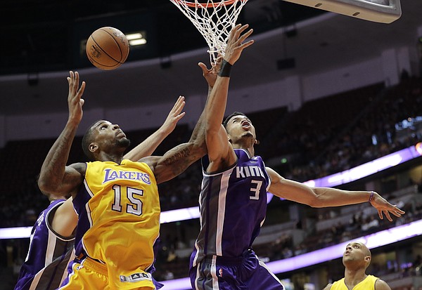 Los Angeles Lakers' Thomas Robinson, left, and Sacramento Kings' Skal Labissiere fight for a rebound during the second half of an NBA preseason basketball game Tuesday, Oct. 4, 2016, in Anaheim, Calif. The Lakers won 103-84. (AP Photo/Jae C. Hong)