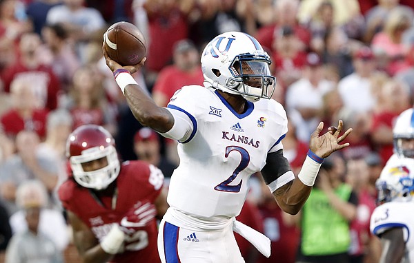 Kansas quarterback Montell Cozart (2) passes against Oklahoma during the first half of an NCAA college football game in Norman, Okla., Saturday, Oct.29, 2016.