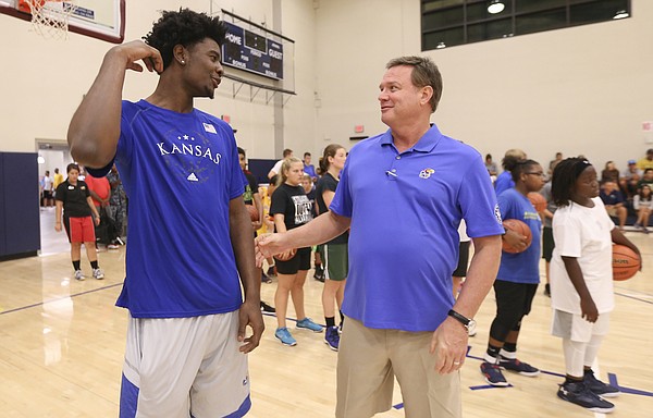Kansas guard Josh Jackson jokes around with head coach Bill Self during a kid's clinic on Wednesday, Nov. 9, 2016 at the Joint Base Pearl Harbor-Hickam fitness center in Honolulu, Hawaii.