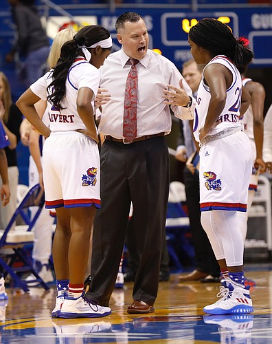 Kansas head coach Brandon Schneider talks with guard McKenzie Calvert (2) left and Jayde Christopher (20) during a timeout in the Jayhawks game against the Missouri State Lady Bears Sunday, Nov. 13, 2016 at Allen Field House. 