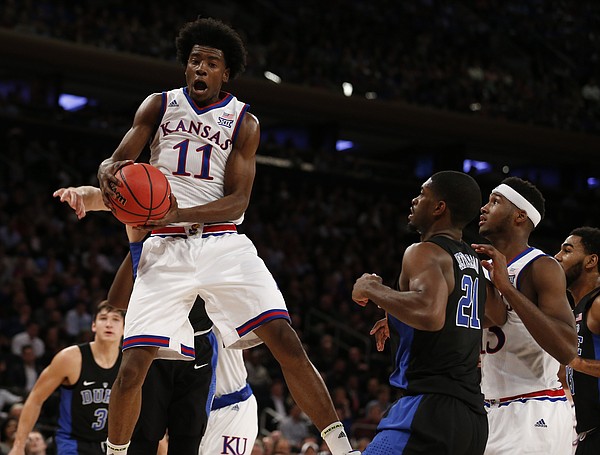 Kansas guard Josh Jackson (11) comes away with a  rebound during the first half of the Champions Classic on Tuesday, Nov. 15, 2016 at Madison Square Garden in New York.