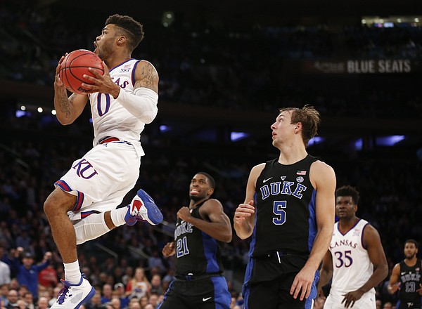 Kansas guard Frank Mason III (0) gets in for a bucket past Duke guard Luke Kennard (5) during the second half of the Champions Classic on Tuesday, Nov. 15, 2016 at Madison Square Garden in New York.