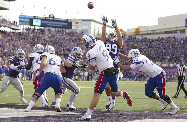 Kansas quarterback Carter Stanley (9) heaves a long pass from the Jayhawks' own end zone during the fourth quarter, Saturday, Nov. 26, 2016 at Bill Snyder Family Stadium.