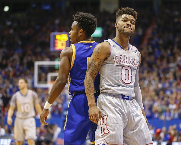 Kansas guard Frank Mason III (0) looks back to the cameras after hitting a three over UMKC guard Dashawn King (1) during the first half, Tuesday, Dec. 6, 2016 at Allen Fieldhouse.